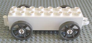 Duplo Wagon Base 2 x 8 x 1 1/2 with Large Dark Gray Spoked Wheels in White