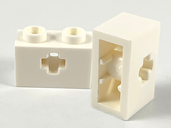 Technic Brick 1 x 2 with Axle Hole Type 1 [+ Opening] and Bottom Pin in White
