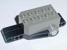 Pullback Motor 9 x 4 x 2 1/3 with Black Base, White Axle Holes, No Studs on Front Top Surface in Dark Gray
