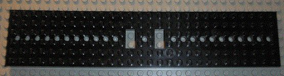 Vehicle Base, Train 6 x 28 with Two 1 x 2 Openings [11 Round Holes Each End and 1 Round Hole at Center] in Black