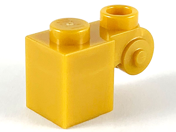 Brick Special 1 x 1 with Scroll with Open Stud in Pearl Gold