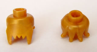Minifig Head Special with Jagged Bottom Edge [Plain] in Pearl Gold