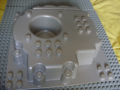 Duplo Baseplate Raised Center with Pit, 12 x 12 with Four Studs in Each Corner in Pearl Very Light Gray