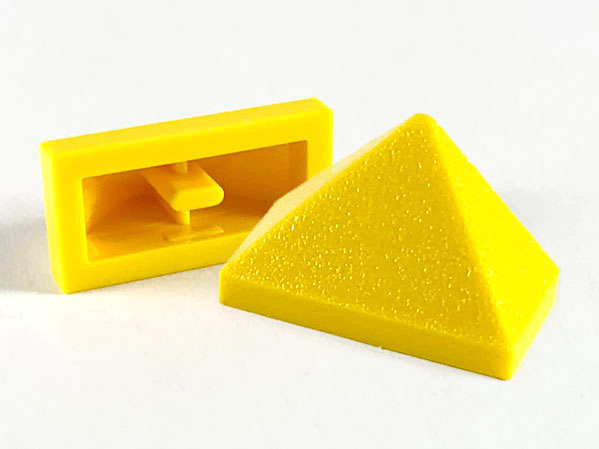 Brick Sloped 45° 2 x 1 Triple with Ovoid Bottom Pin in Yellow