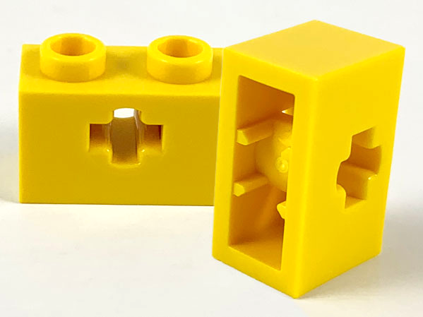 Technic Brick 1 x 2 with Axle Hole Type 1 [+ Opening] and Bottom Pin in Yellow