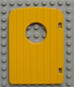 Duplo Door 1 x 4 x 4 with Porthole and 7 Vertical Grooves in Yellow