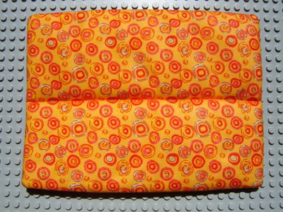 Scala, Mattress, Divided with Solid Red Reverse Side of Multi Color Circles Print in Orange