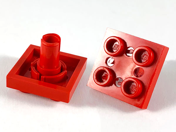 Plate Special 2 x 2 with Pin on Bottom, Small Holes in Plate and Rotational Locking Fingers on Underside in Red