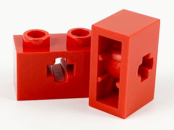 Technic Brick 1 x 2 with Axle Hole Type 1 [+ Opening] and Bottom Pin in Red