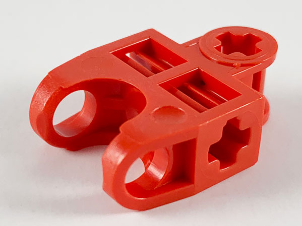 Technic Axle Connector 2 x 3 with Ball Socket, Open Sides in Red