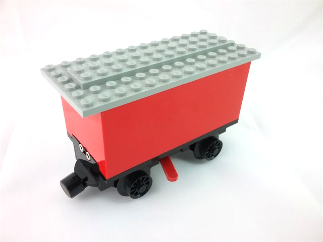 Battery Box, Train Car with Black Base, Red Wheels and Magnets in Red
