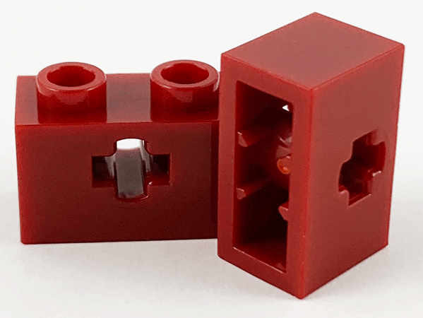 Technic Brick 1 x 2 with Axle Hole Type 1 [+ Opening] and Bottom Pin in Dark Red