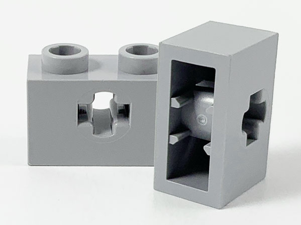 Technic Brick 1 x 2 with Axle Hole Type 1 [+ Opening] and Bottom Pin in Light Bluish Gray